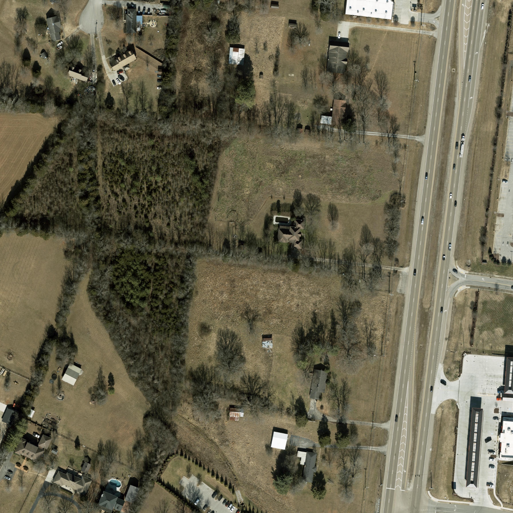 Archival aerial view of the Shelbyville Pike property before grading